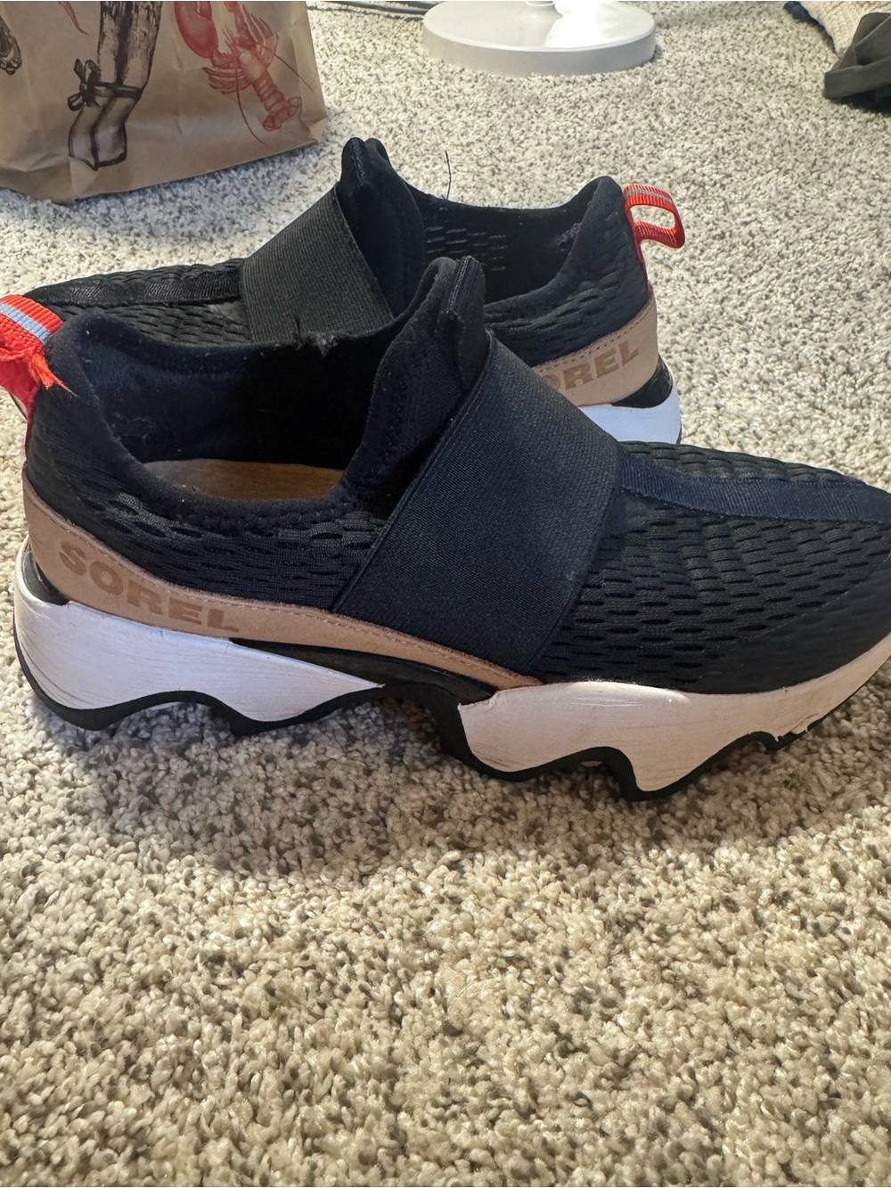 Sorel  Black Slip-On Sneakers with Tan Accents
